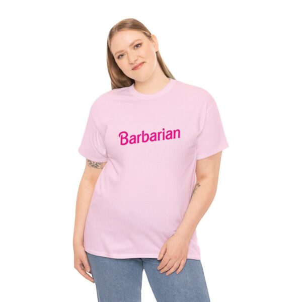 A barbie barbarian shirt, fun dungeons and dragons shirts, pink and worn by a woman