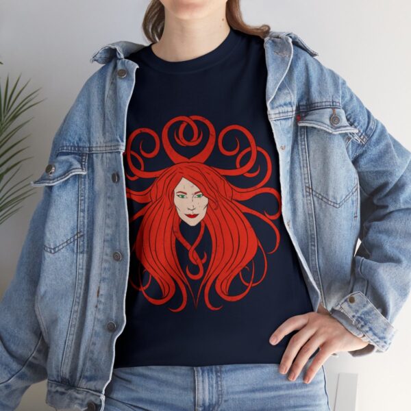 The symbol of Sune, the face of a red-haired, ivory-skinned beautiful woman, on a navy blue t-shirt under a jean jacket