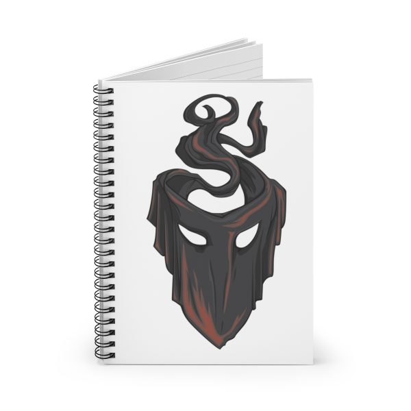 The symbol of mask, a black velvet mask, on a notebook, front open