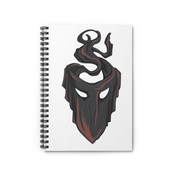 The symbol of mask, a black velvet mask, on a notebook, front