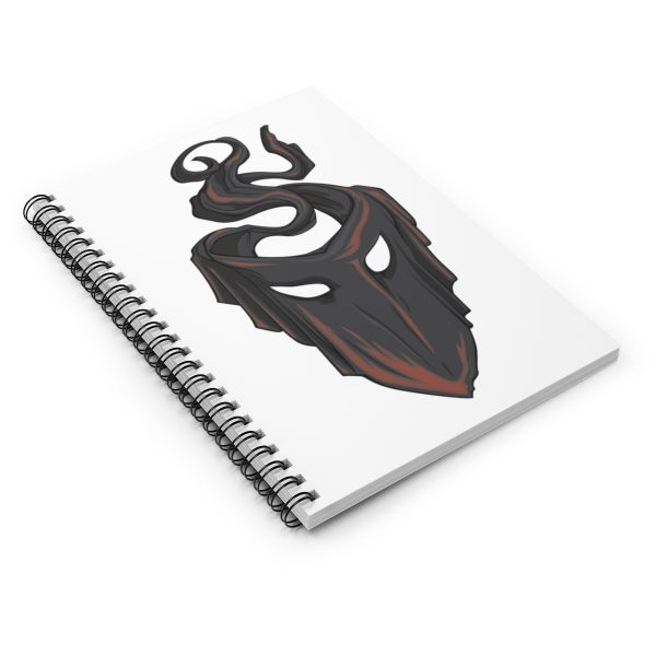 The symbol of mask, a black velvet mask, on a notebook, angled