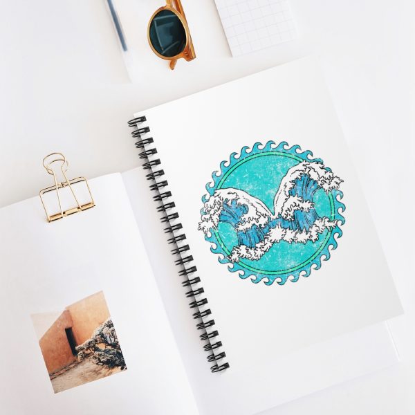 Spiral notebook with the symbol of Umberlee, two opposing waves, on desk