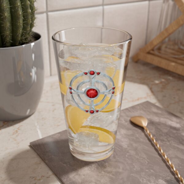 16 oz pint glass with the dnd symbol of St, Cuthbert, fantasy deity of dungeons and dragons, lemonade