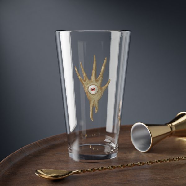 16 oz pint glass with the dnd symbol of Vecna, fantasy deity of dungeons and dragons, on desk