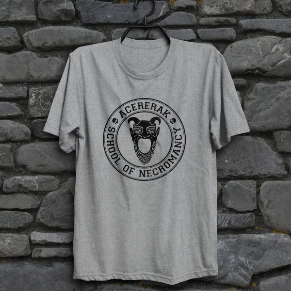 A fun collegiate shirt for Acererak's School of Necromancy - Acererak is a famous undead Lich and villain in DnD. This is a sport gray shirt hanging on a wall.