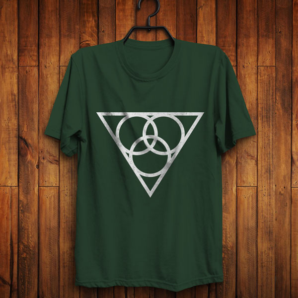 The symbol of Angharradh, three rings on a triangle, on a forest green shirt, hanging