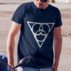 The symbol of Angharradh, three rings on a triangle, on a navy blue shirt, worn by a man