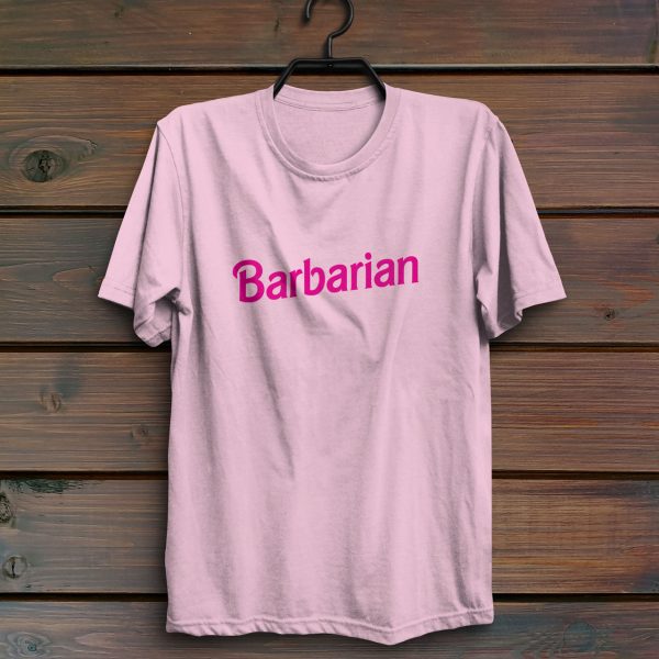 A barbie barbarian shirt, fun dungeons and dragons shirts, pink hanging on a wall