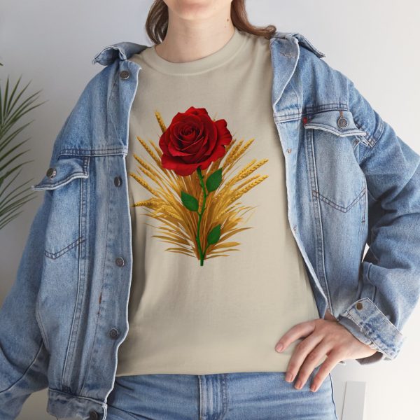 The symbol of Chauntea, a blooming rose on a sunburst wreath of golden grain. Chauntea is the goddess of life and agriculture. On a tan sand shirt worn by a woman wearing a jacket.