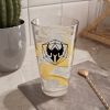 A drinking glass featuring the DnD symbol of the Barbarian class, lemonade