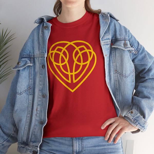 The symbol of Hanali Celanil, a gold heart, on a red shirt under a jean jacket