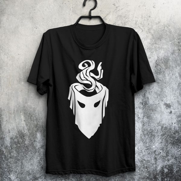 The symbol of mask, a black velvet mask, on a black shirt hanging on a wall