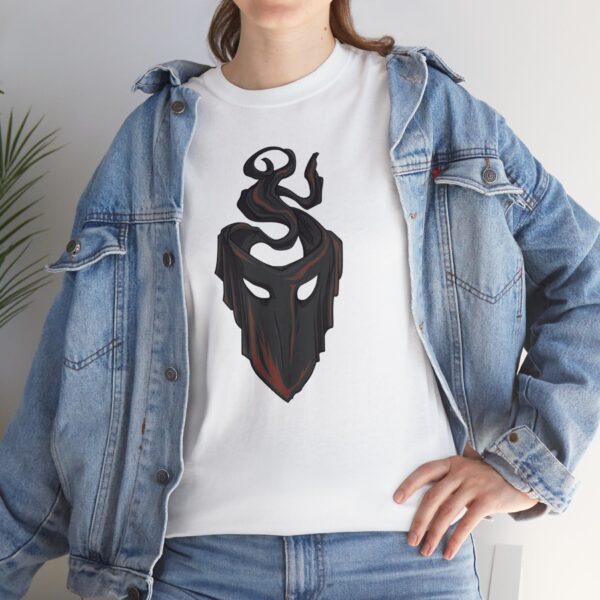 The symbol of mask, a black velvet mask, on a white shirt under a jean jacket