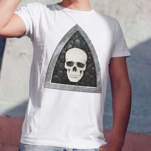 The symbol of Myrkul, a white human skull on a black field, on a white shirt worn by a man against a wall