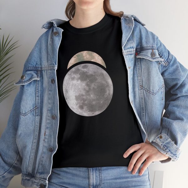 The symbol of Sehanine Moonbow, a misty crescent above a full moon, on a black shirt under a jacket