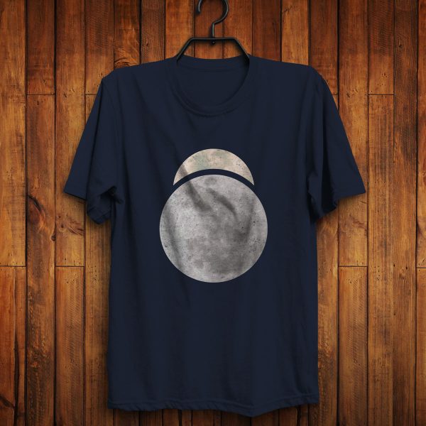 The symbol of Sehanine Moonbow, a misty crescent above a full moon, on a navy blue shirt hanging on a wall