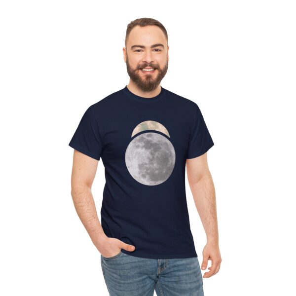 The symbol of Sehanine Moonbow, a misty crescent above a full moon, on a navy blue shirt worn by a man