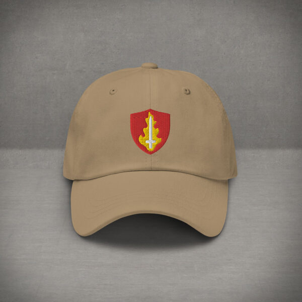 A hat with the symbol of Tempus, an upright flaming sword. The god of war in DnD. Tan Hat