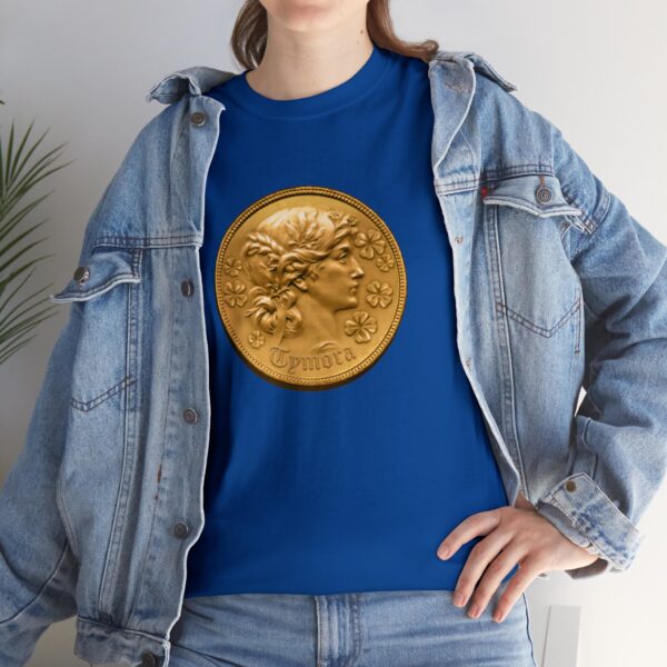 Coin with Tymora's face, the symbol of Tymora, on a royal blue shirt under a jacket