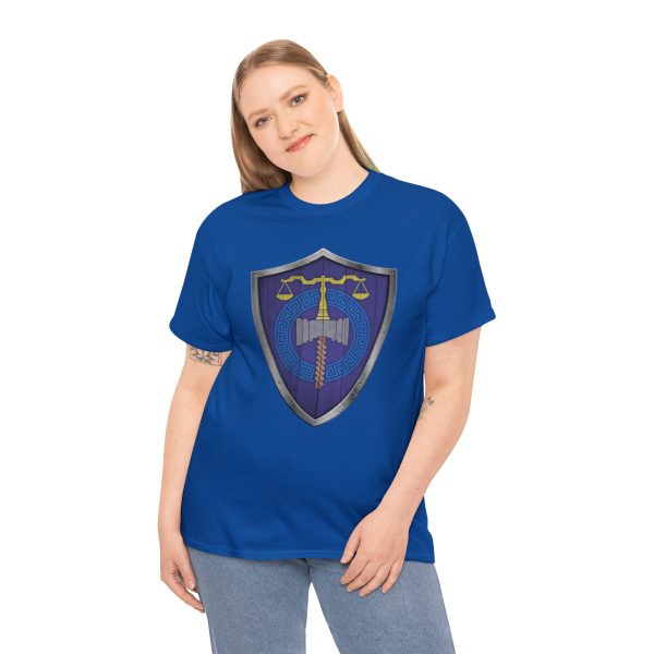 The DnD symbol of Tyr, balanced scales resting on a warhammer, representing justice through force, on a royal blue shirt worn by a woman