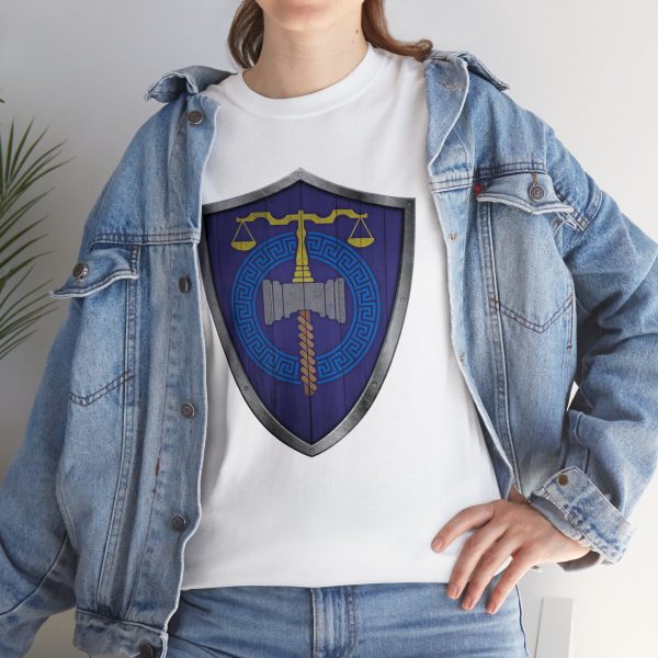 The DnD symbol of Tyr, balanced scales resting on a warhammer, representing justice through force, on a white shirt under a jean jacket