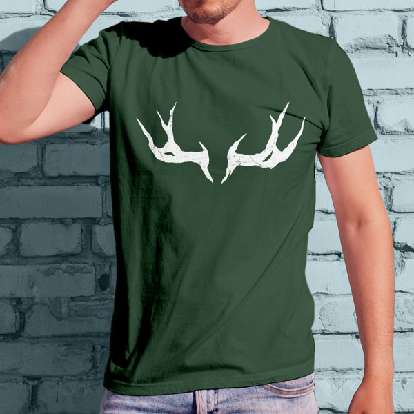 Uthgar Elk Horn symbol on a forest green shirt worn by a man against a wall