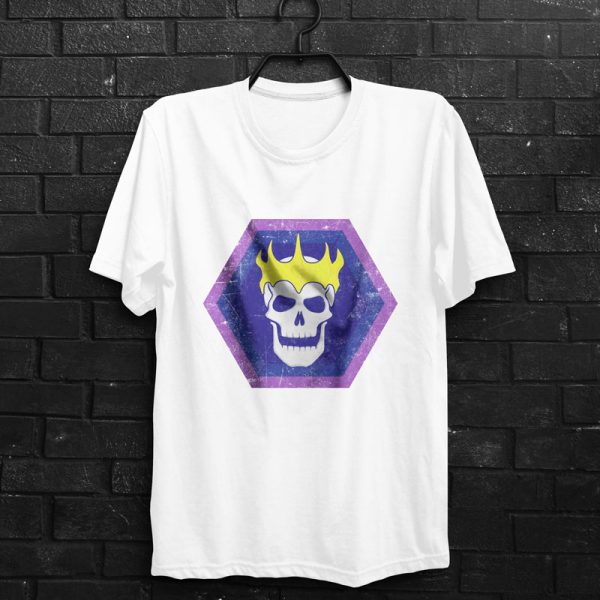 White t-shirt with the symbol of Velsharoon, a crowned laughing lich on a solid blue hexagon, hanging on a wall