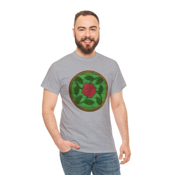 The symbol of Chauntea on a shield, a blooming rose on a sunburst wreath of golden grain. Chauntea is the goddess of life and agriculture. On sport gray shirt worn by a man