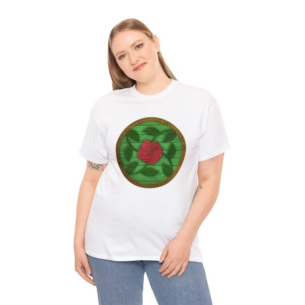 The symbol of Chauntea on a shield, a blooming rose on a sunburst wreath of golden grain. Chauntea is the goddess of life and agriculture. On white shirt worn by a woman