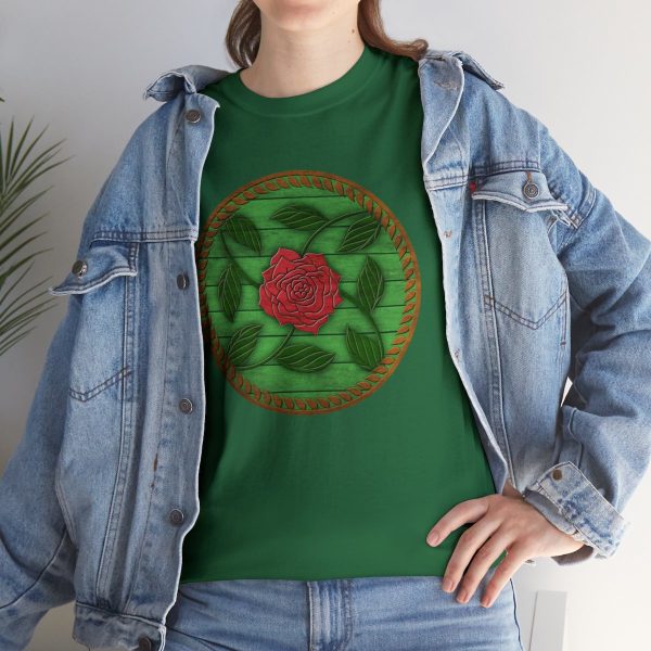 The symbol of Chauntea on a shield, a blooming rose on a sunburst wreath of golden grain. Chauntea is the goddess of life and agriculture. On a turf green shirt under a jean jacket.