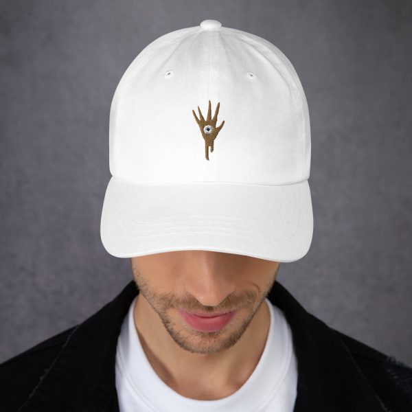 A white DnD hat with the symbol of Vecna, evil lich and villain, on man looking down