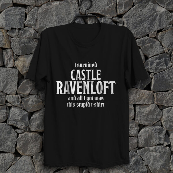 A black D&D shirt telling people that you survived castle ravenloft of the Curse of Strahd, against a wall